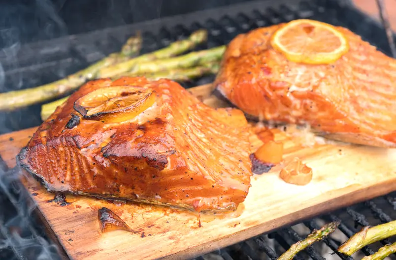 Salmon on cedar planks on the grill.