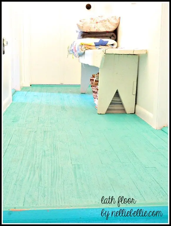 Cheap DIY flooring idea using lath (usually a lumber yards cheapest wood) and painting with high quality porch paint.