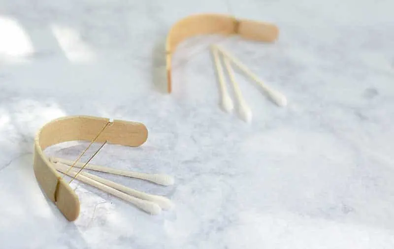 This mini bow and arrow tutorial from NellieBellie is easy to follow and a fantastic popsicle stick craft to make on a rainy afternoon. DIY bow and arrow.