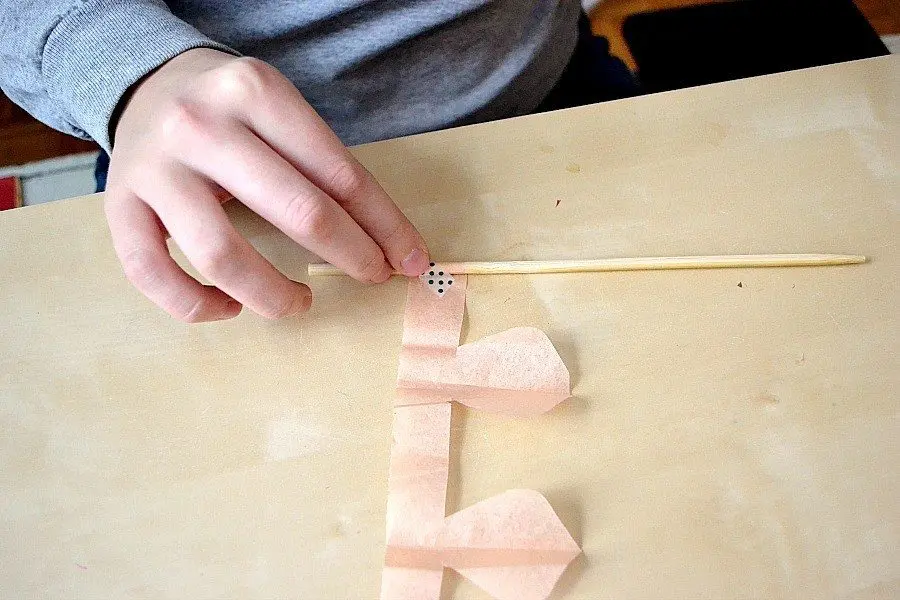 attach tissue to pencil