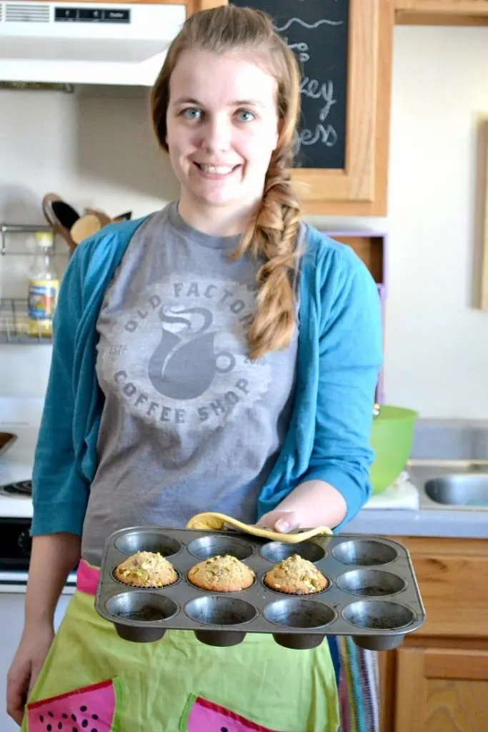 The Bellie looking adorable with pistachio muffins in her apron. nelliebellie.com