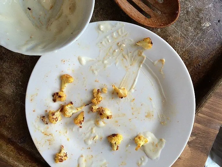 Roasted buffalo cauliflower remnants, it took us about 5 seconds to eat; so good! from nelliebellie.com
