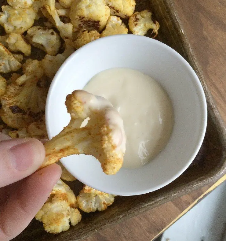 Roasted buffalo cauliflower recipe from nelliebellie.com healthy snack ideas