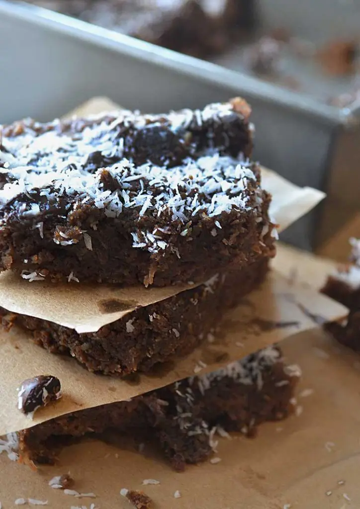 These healthier brownies are made with almond flour, dates, and coconut so they are gluten free and full of vitamins! Don't be afraid to try these gluten-free coconut brownies, even if you don't have dietary restrictions; you'll love them!