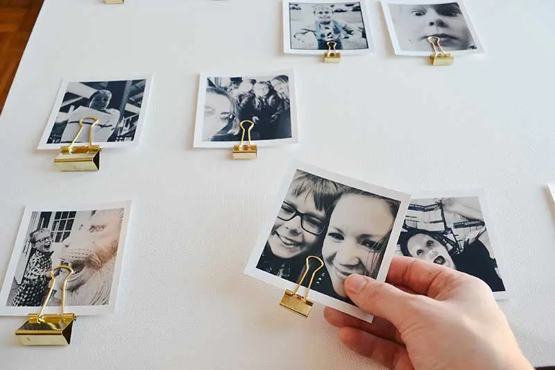Make a photo display canvas to display your pictures without putting multiple nails in the wall. A great renter's solution!