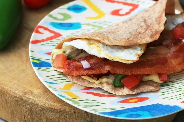 Breakfast tacos! With egg, hummus, bacon, and pico de gallo. Yum!
