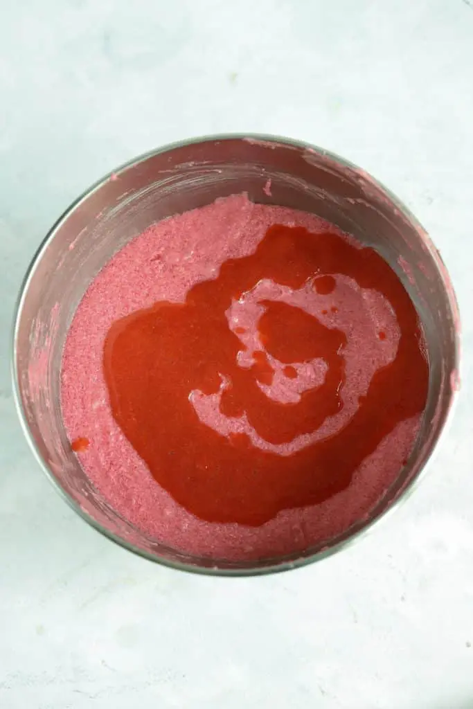 strawberry cake puree being added