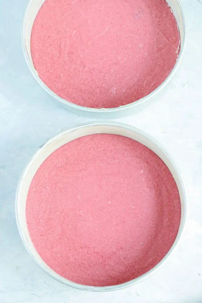 strawberry cake batter in pans