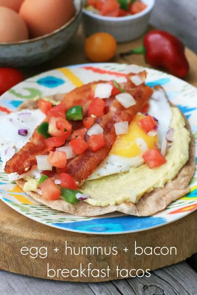 Homemade breakfast tacos! With hummus, bacon, egg, and pico de gallo. Repin to save!