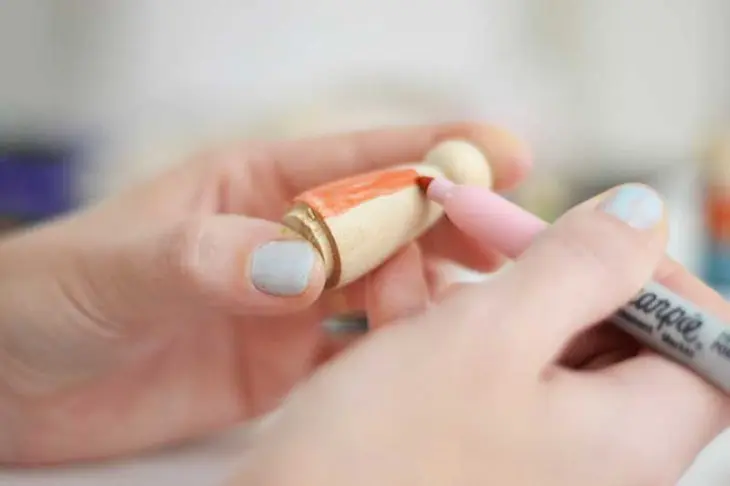 Use Sharpies to personalize your peg family art.