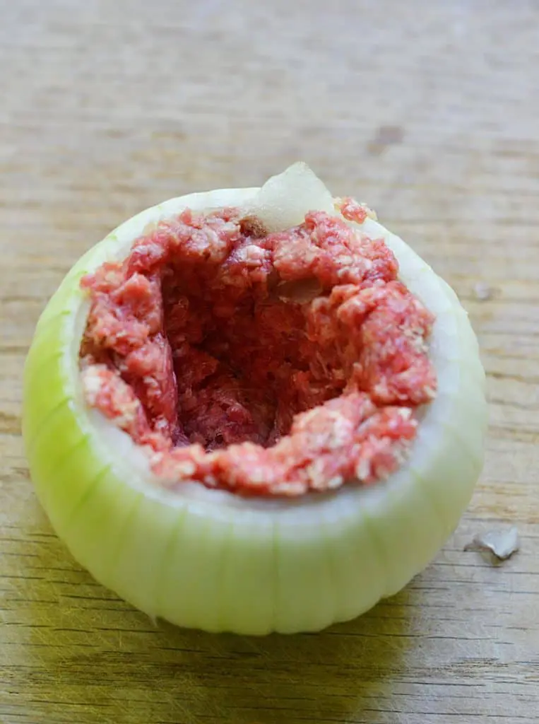 Onion bomb. Vidalia onion stuffed with ground beef, cheese, wrapped in bacon, and topped in bread crumbs.