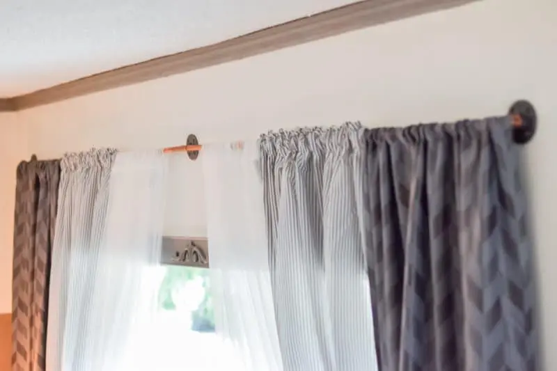 living room makeover - after photo, copper pipe curtain rod 