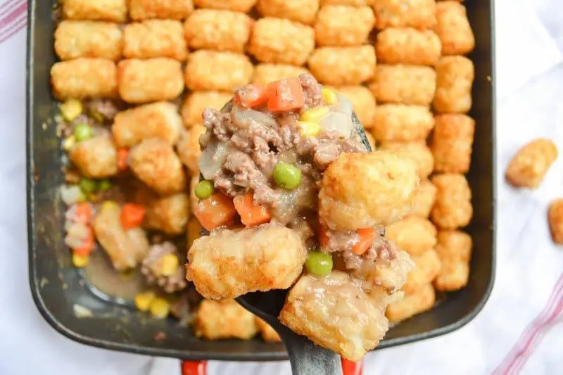 Also called "tater tot casserole", Tater Tot hotDish is a traditional Minnesotan dish complete with a variety of veggies and tater tots on top.