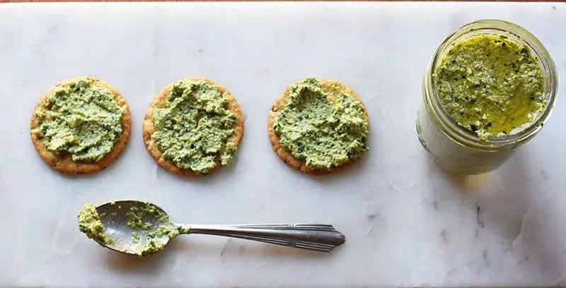 Collard greens and olives pesto recipe for a delicious and easy twist on the traditional basil pesto recipe!
