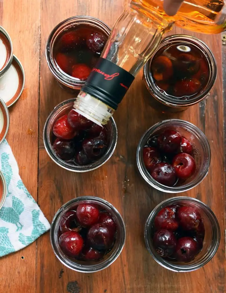 Make your own cherry-infused bourbon with this easy and simple process. A great gift idea, cocktail ingredient, and treat for bourbon lovers.