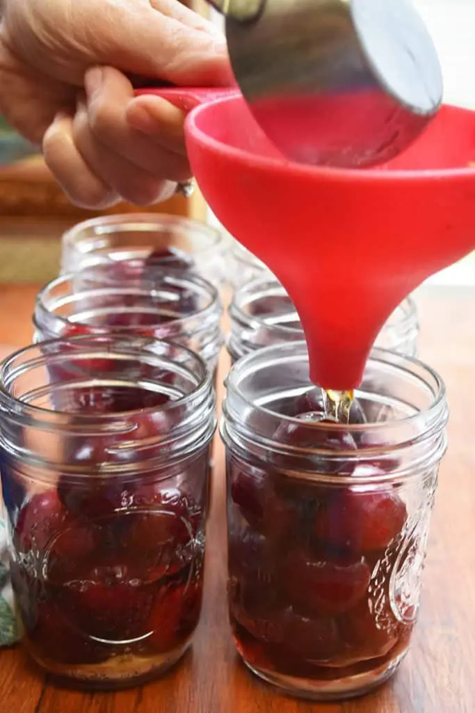 Make your own cherry-infused bourbon with this easy and simple process. A great gift idea, cocktail ingredient, and treat for bourbon lovers.