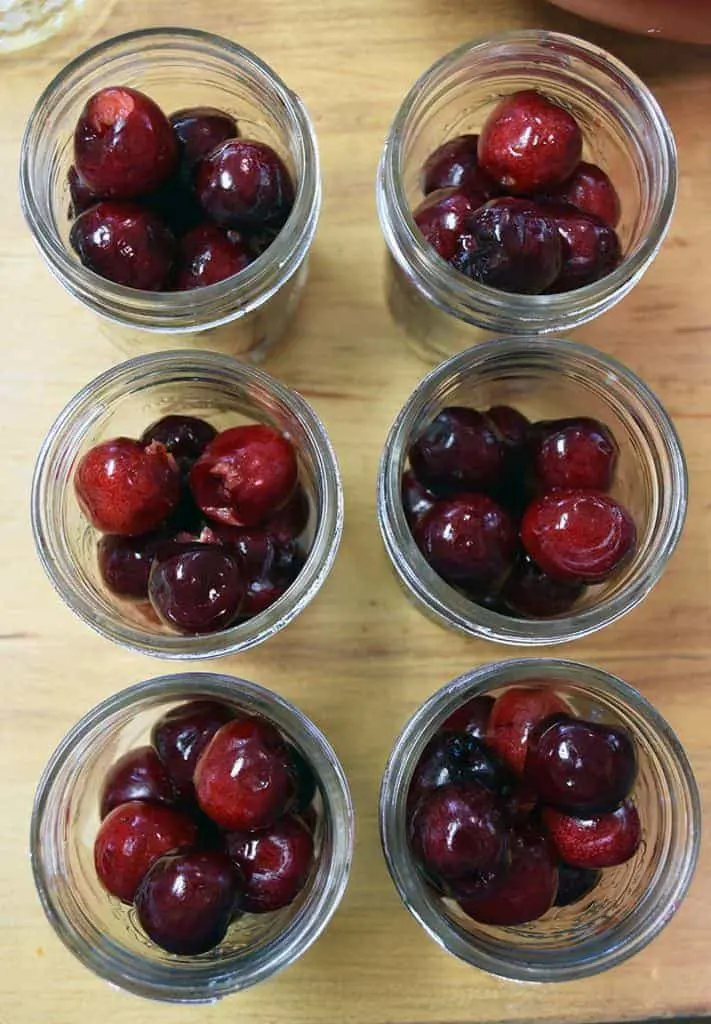 Make your own cherry-infused bourbon with this easy and simple process. A great gift idea, cocktail ingredient, and treat for bourbon lovers.
