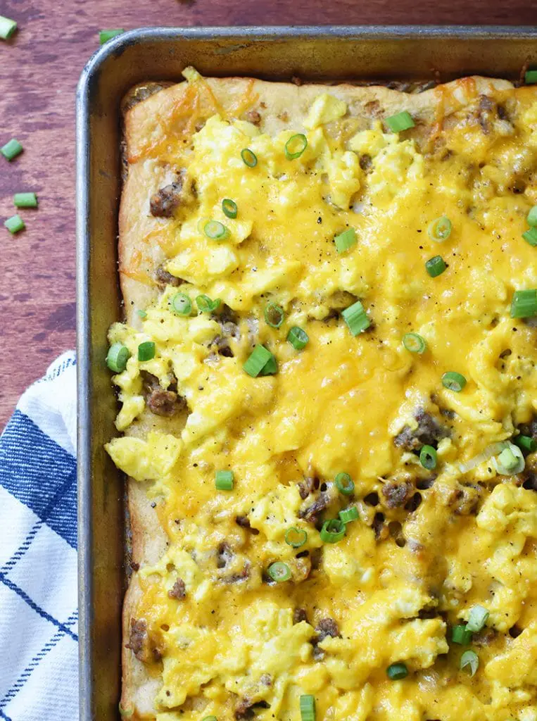 A sheet pan will biscuits and gravy breakfast pizza.
