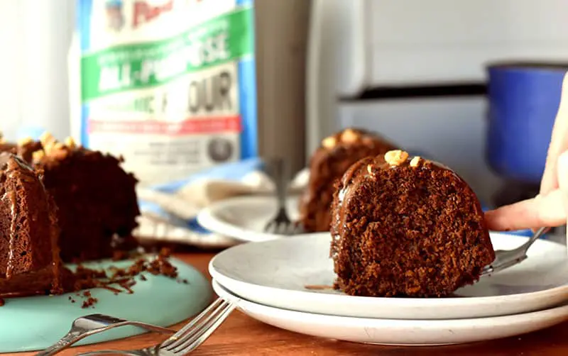 chocolate dripping on to an old-fashioned brownie bundt cake. A simple, easy recipe for a brownie cake! #browniecake #fromscratch #easyrecipe #chocolate