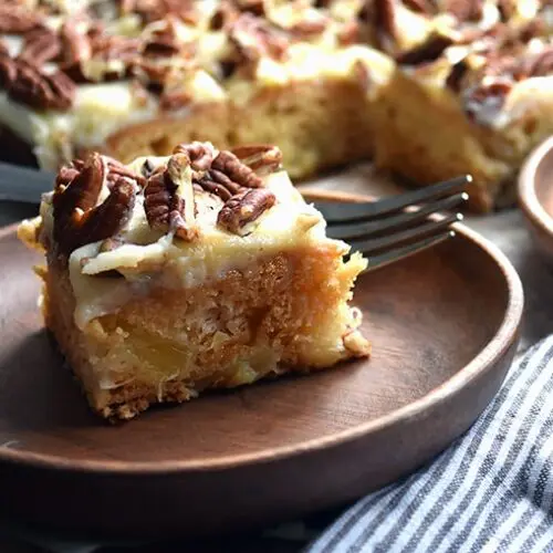 2 slices of pineapple cake on plates