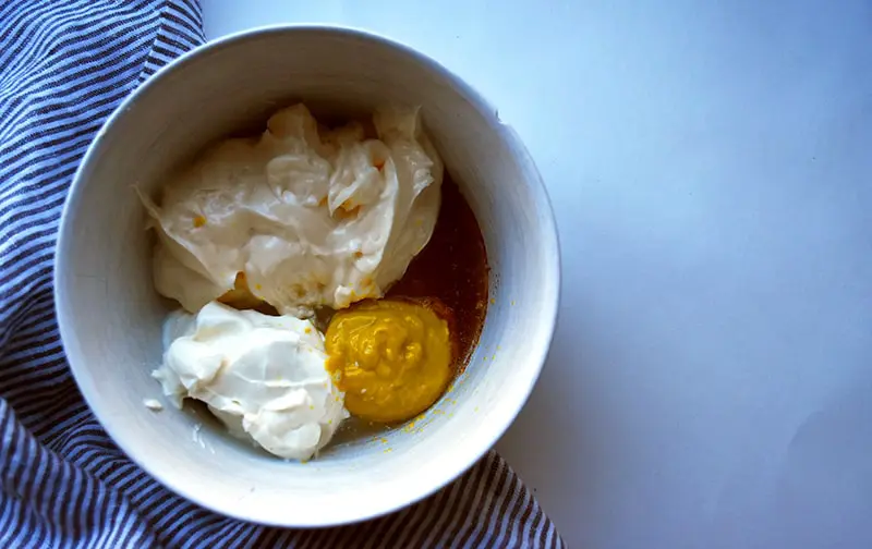 deviled egg potato salad dressing with mayo, sour cream, yellow mustard, white vinegar, and paprika