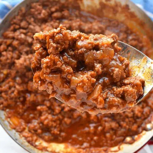 an easy and delicious sloppy joe sauce in a large spoon scooped from a skillet