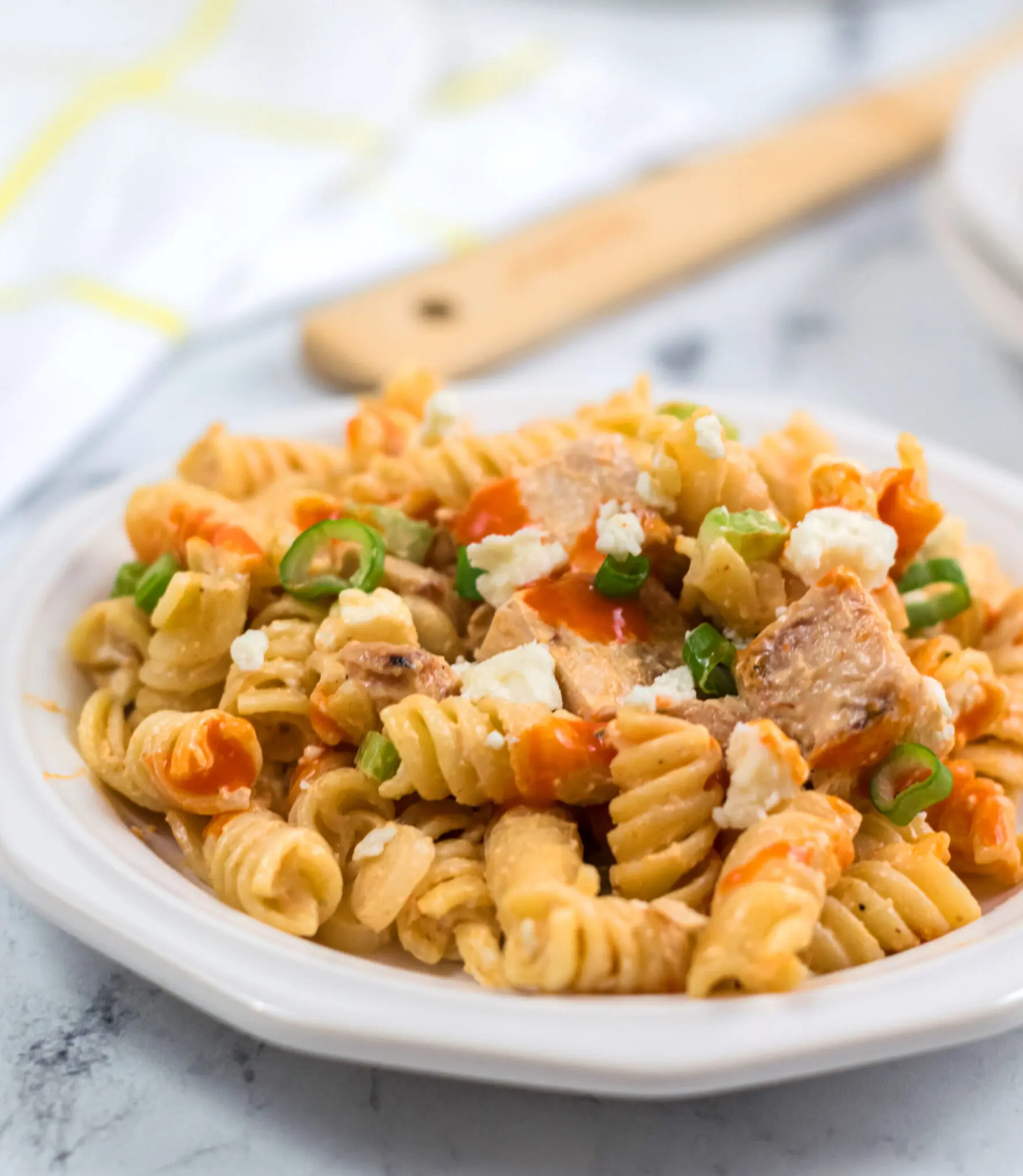 A plate full of creamy buffalo chicken pasta salad