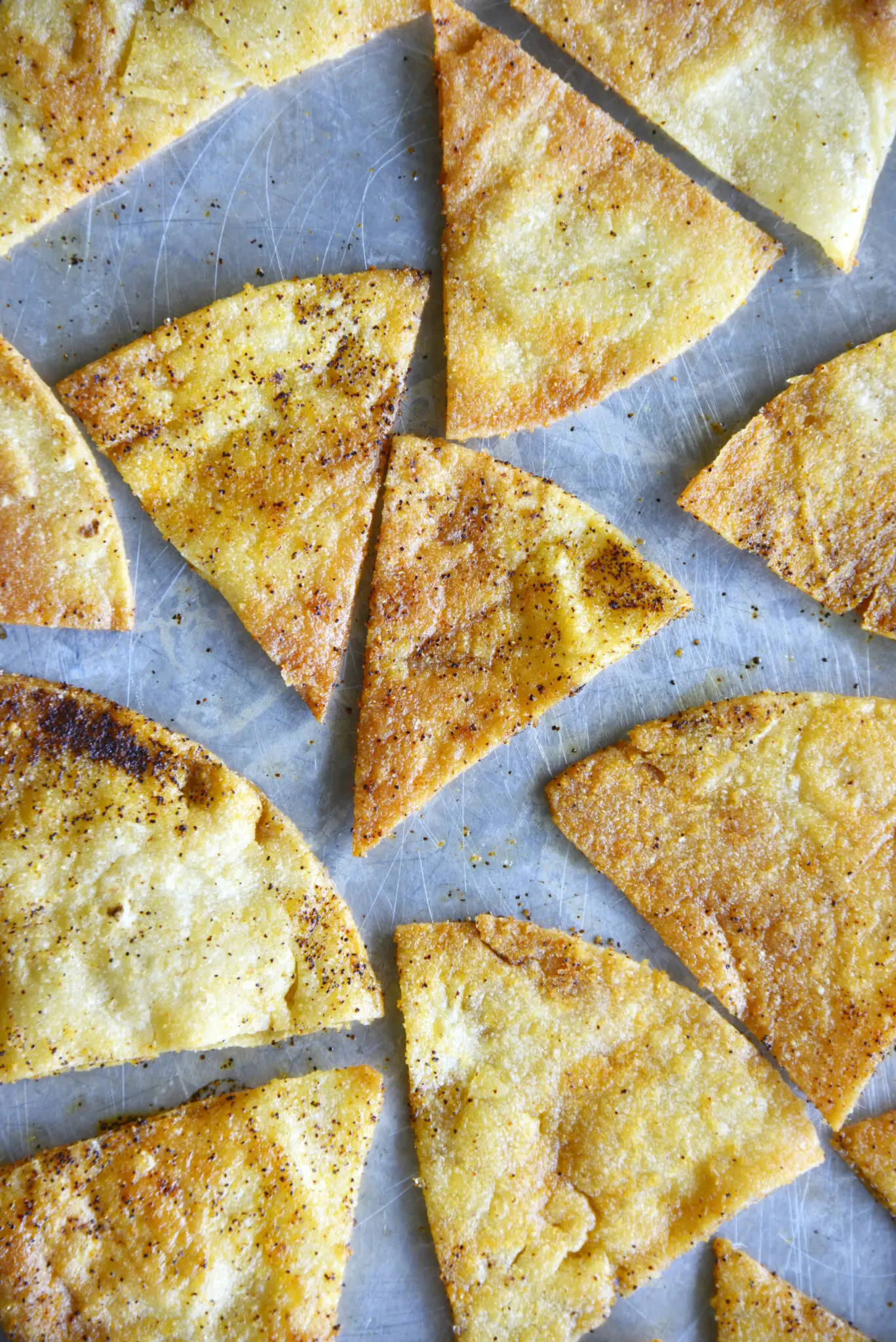 a sheet pan of baked tortilla chips
