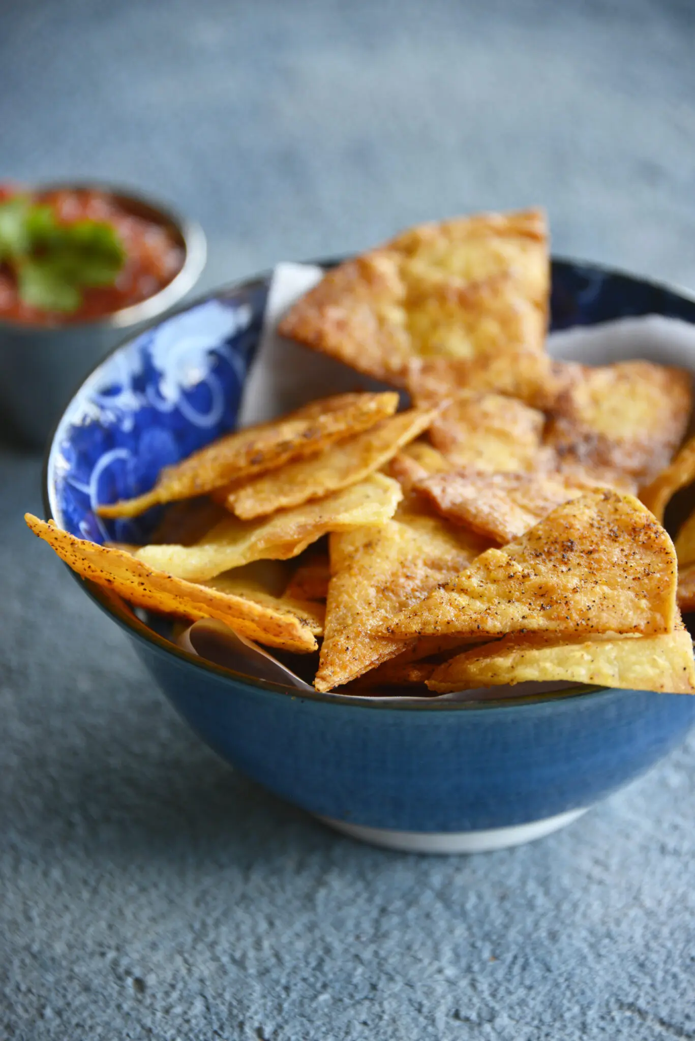 A bowl of baked tortilla chips.