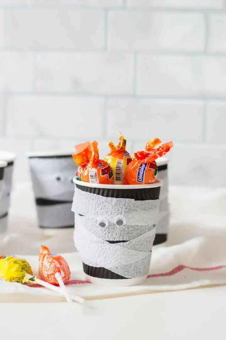 Fill your Halloween treat cups with candy!
