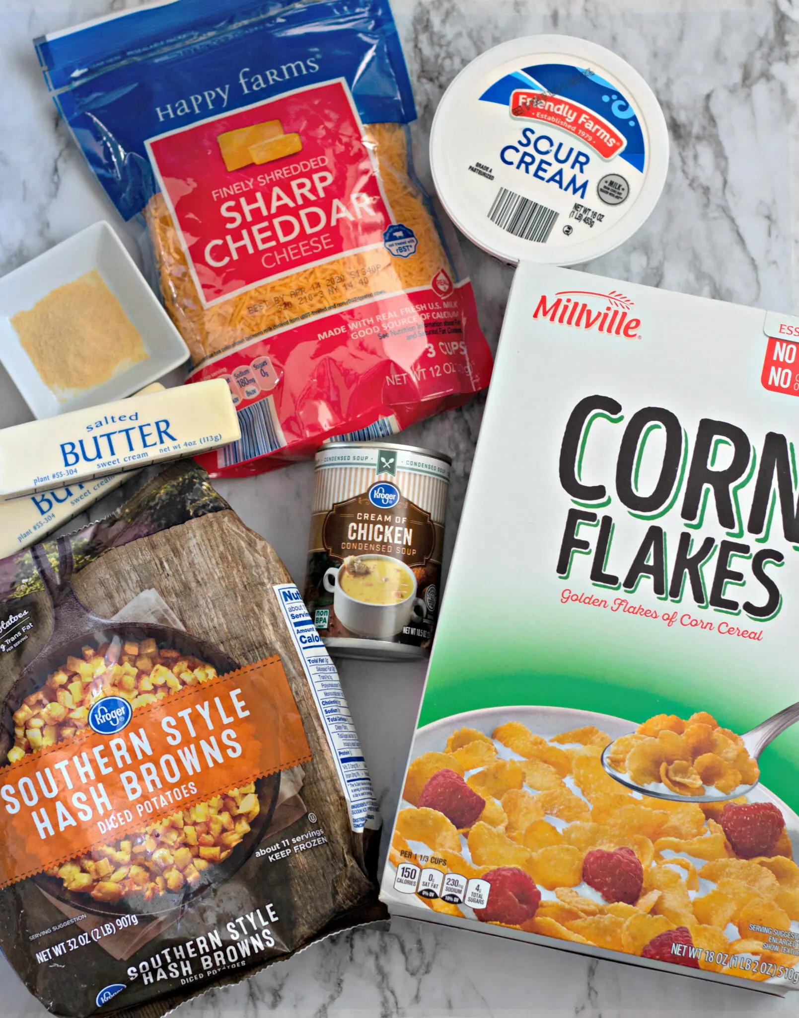 Needed ingredients for funeral potatoes include diced frozen potatoes, cheese, cornflakes, butter, and cream of chicken soup.