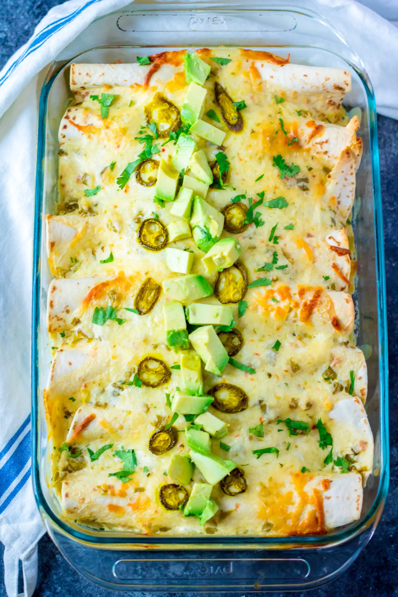A golden pan of cheesy enchiladas
