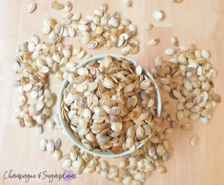 Overflowing bowl of pumpkin spice roasted pumpkin seeds