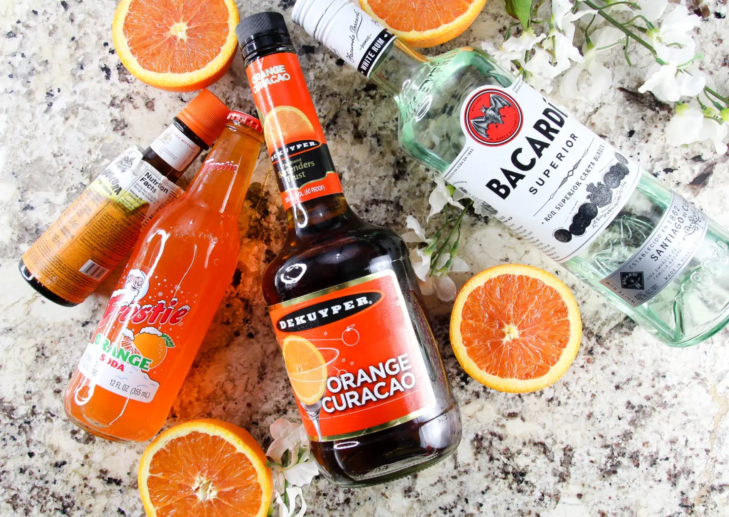 Ingredients needed for orange sunset cocktail are orange soda, orange curacao (or triple sec), and rum. 