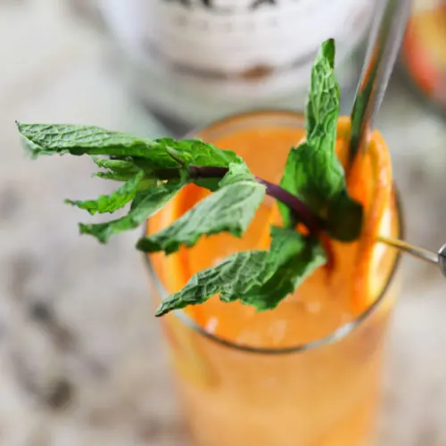 Bacardi rum in an orange sunset cocktail with fresh mint
