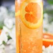 fresh orange slices and mint in an orange cocktail