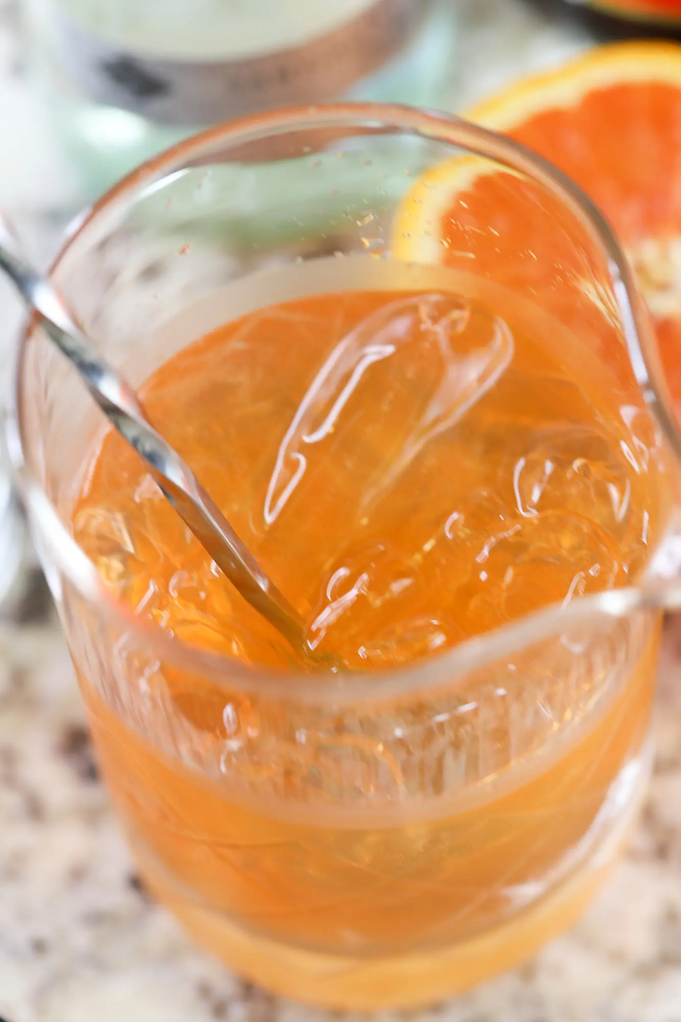 a pitcher with fresh orange rum cocktail