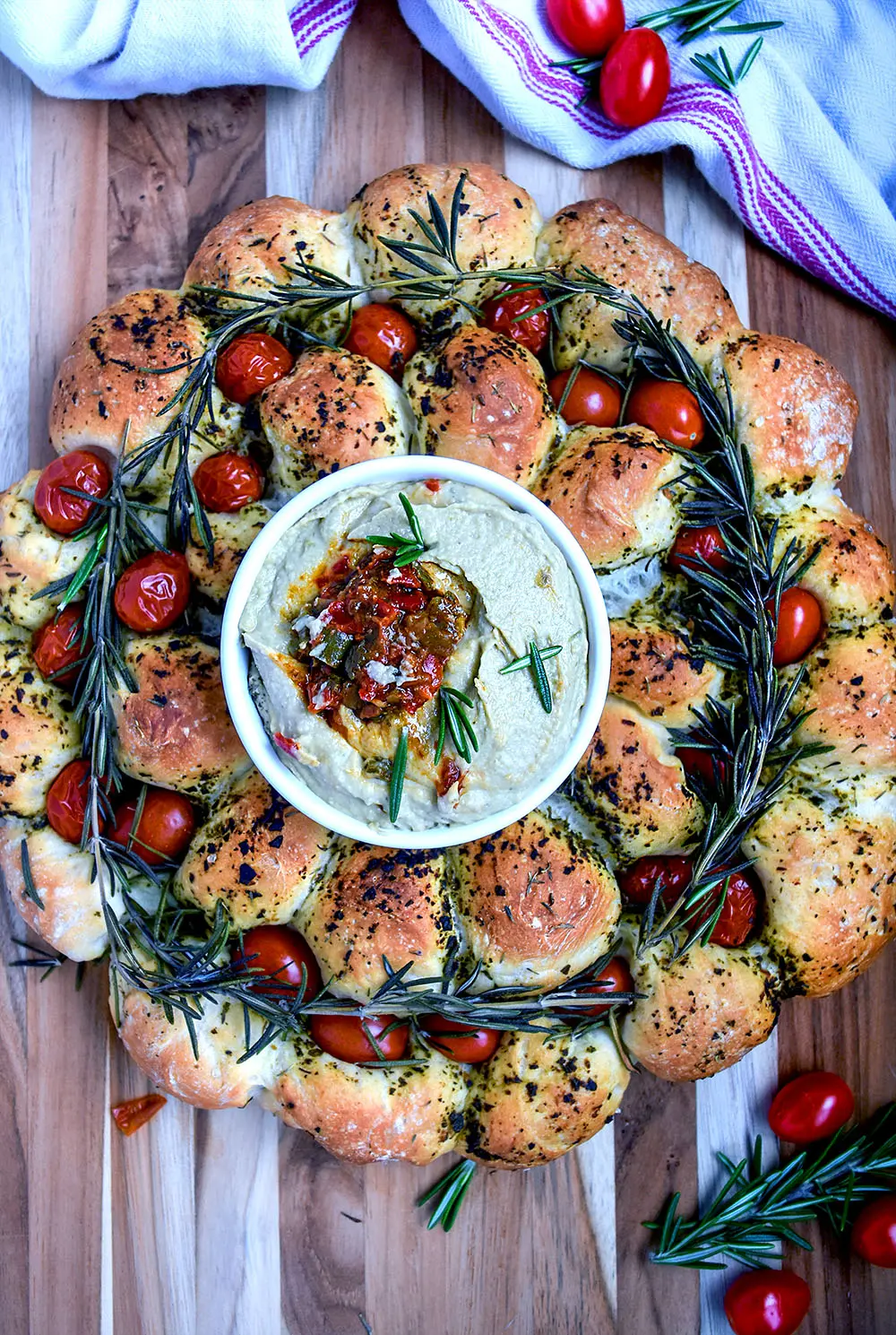 Christmas bread sharing wreath baked and with dip in the center.