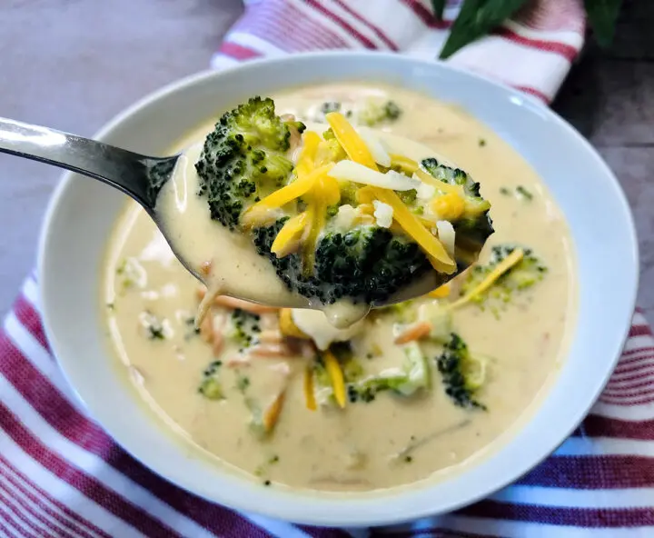 Spoon of broccoli and cheese soup.
