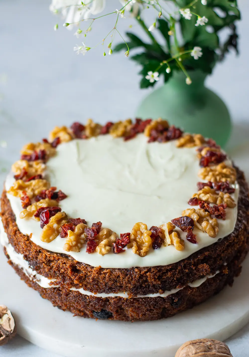 A carrot raisin cake with cream cheese frosting