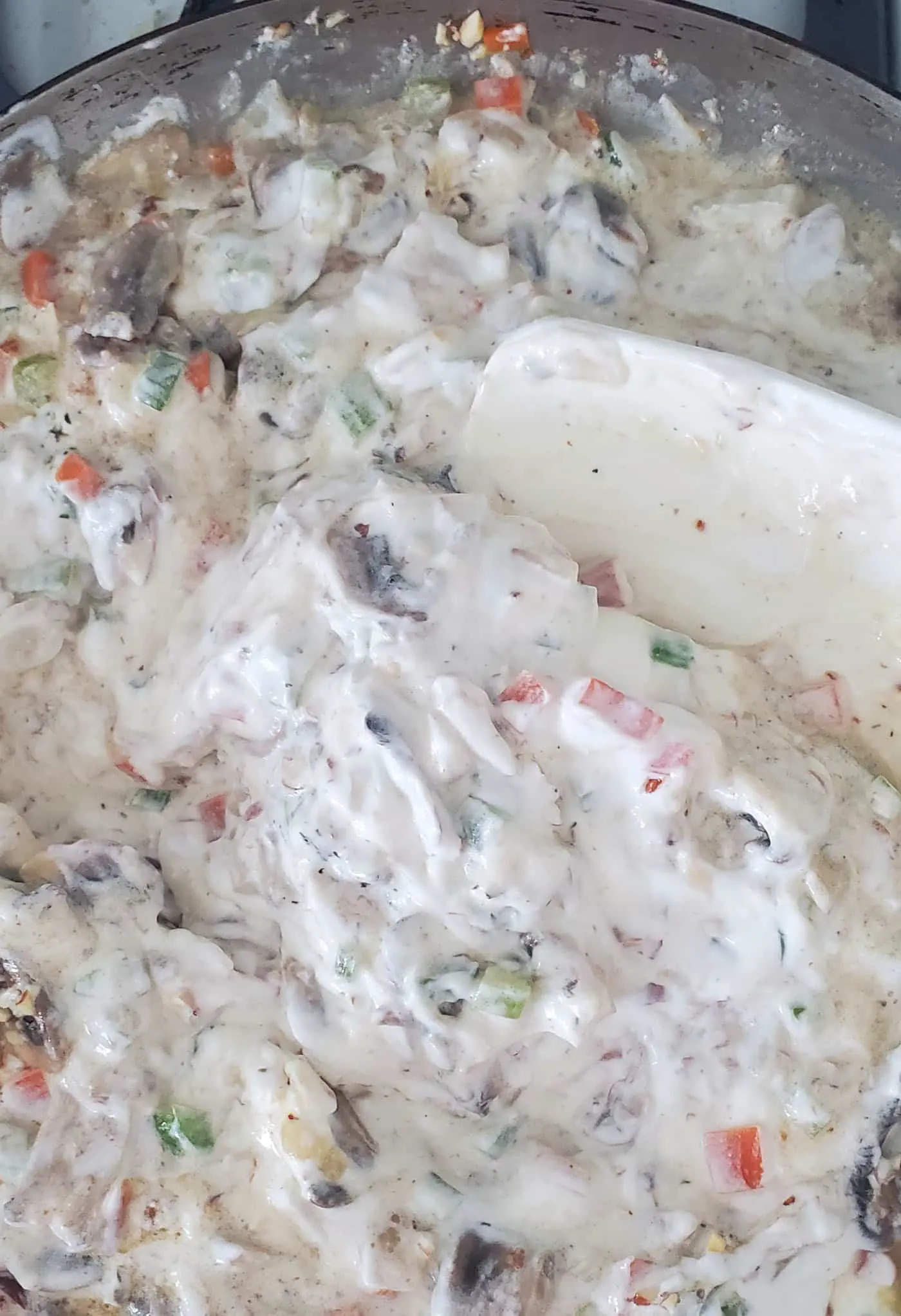 mix the sour cream, veggies, and almonds together for the hotdish