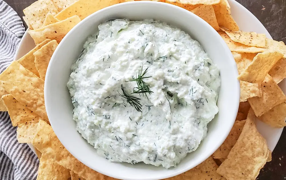 A bowl of Greek Yogurt, Cucumber, and fresh dill made into a yummy dip