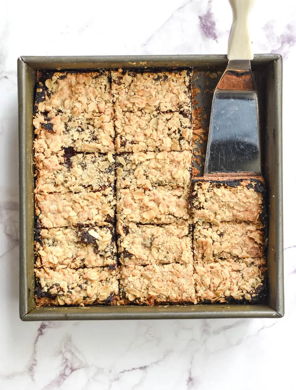 a pan of cut old-fashioned date bars