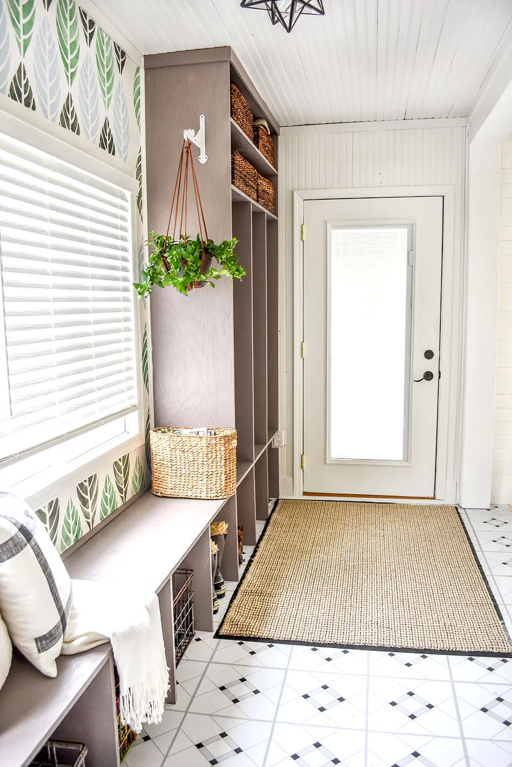 A long hallway turns into a beautiful entry with custom cubbies.
