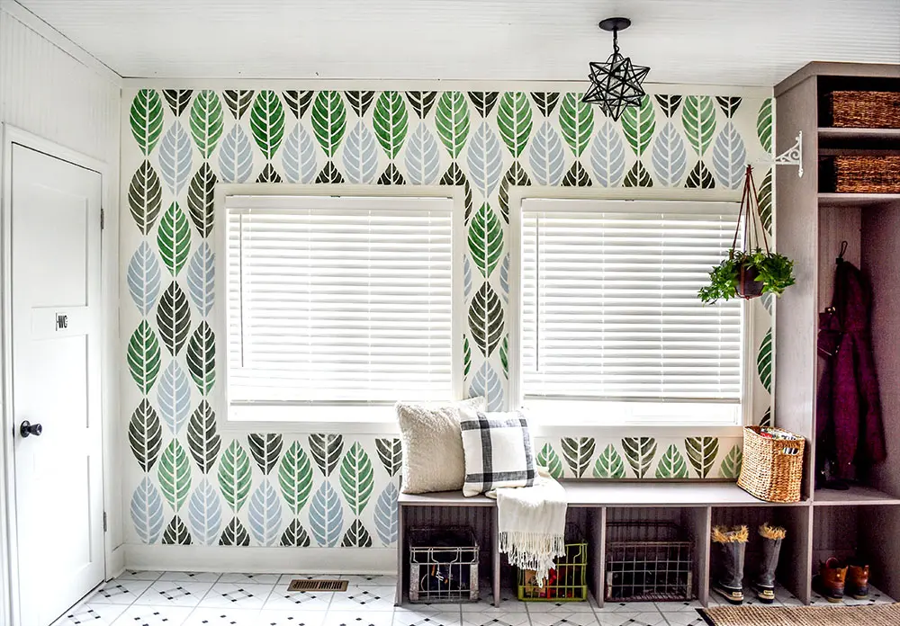 What a beautiful stenciled wall and those cubbies!