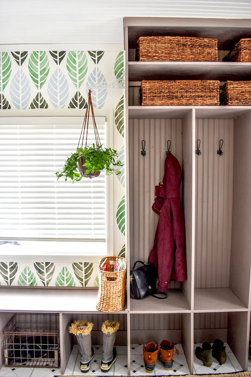 A gorgeous updated entry with DIY cubbies, stenciled wall, and many more beautiful details.