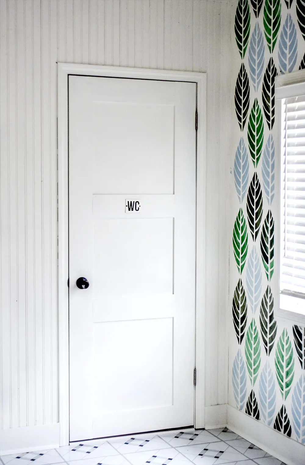 Turn a hollow door into a beautiful door with simple boards and paint.
