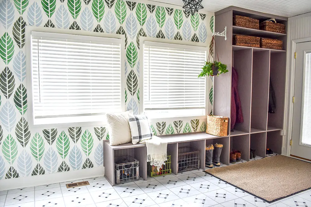 Beautiful entry with cubbies and stenciled wall.