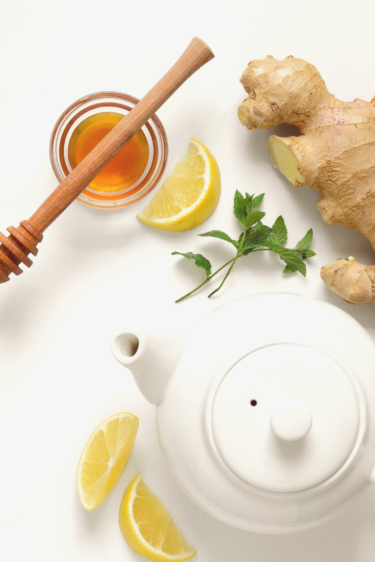 A tea pot, fresh ginger root, honey, and lemon are what you need to make homemade ginger root tea.