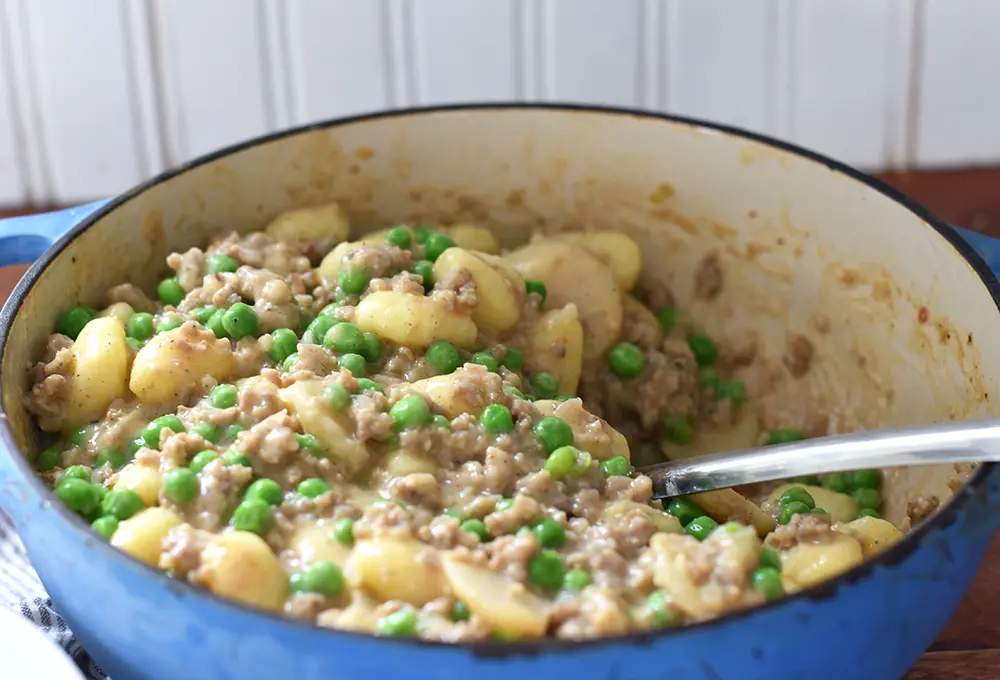 creamy gnocchi alfredo with fresh peas and water chestnuts
